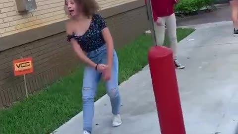 Girls fight outside at a restaurant