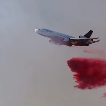 Red fire retardant foam, for class B fires, forms a barrier that cuts off oxygen