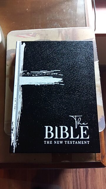 New Bible with black paper and white letters