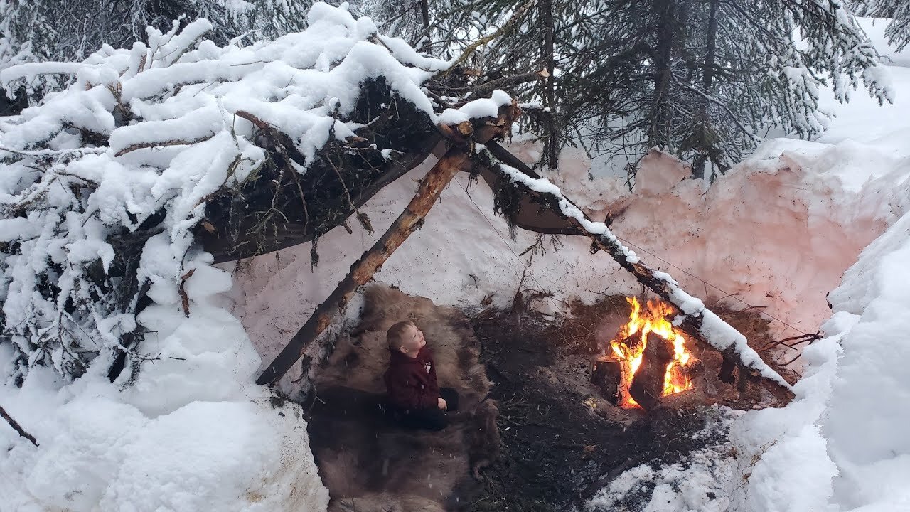 Winter Camping in Bushcraft Shelter with Animal Hides for a Bed (in Deep Snow)