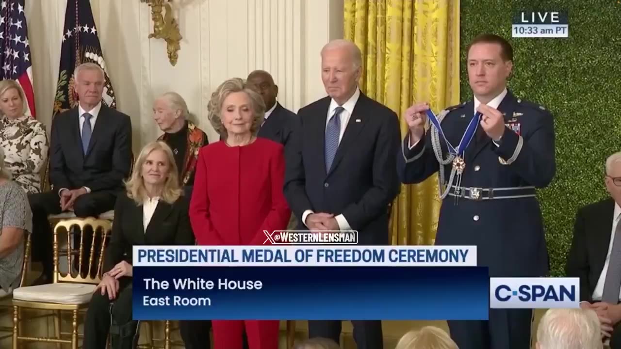 Hillary Clinton receives the Presidential Medal of Freedom from Joe Biden