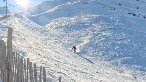 Snowboarder Crashes Over Fence