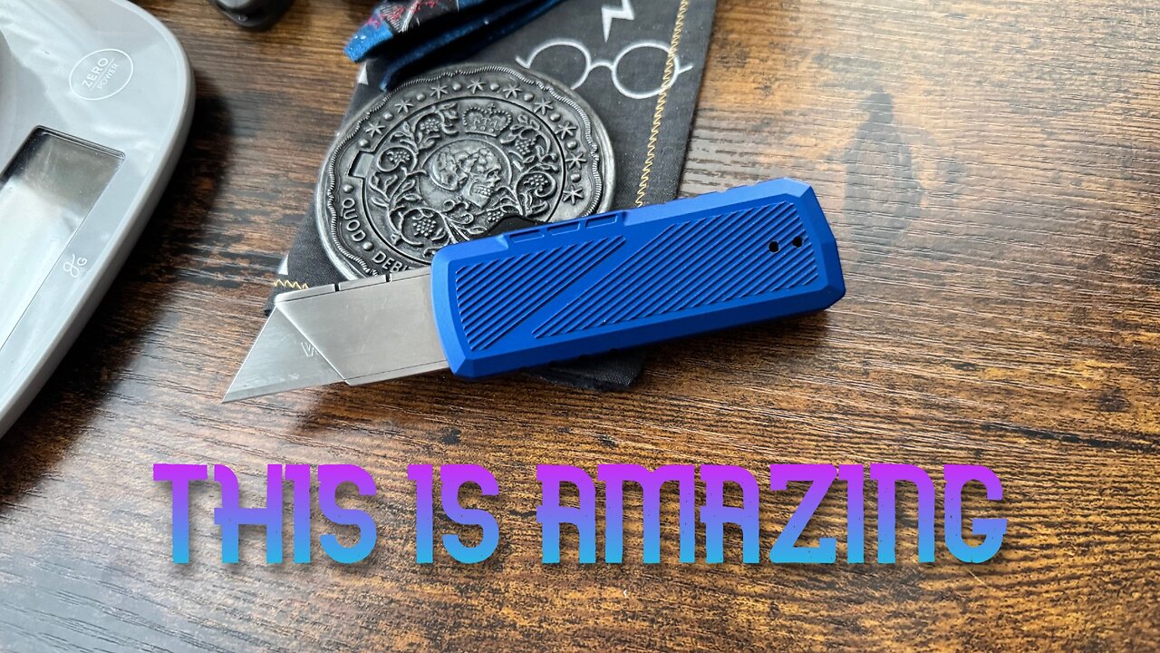 A cool OTF utility knife from TacKnives