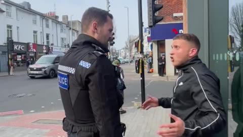 British police take away Christian preacher's microphone