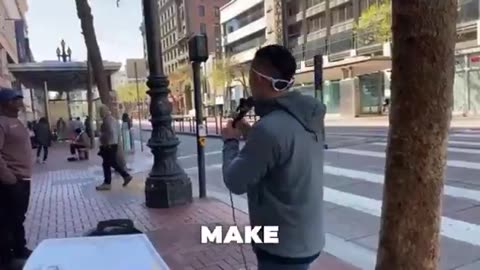 Trans person pulls a gun on a street preacher for saying that God made men to