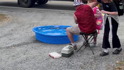 Dad Embarrasses Daughters by Fishing at Bus Stop