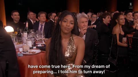 Harrison Ford spotted eating during the intro of the SAG Awards before realizing he was on camera