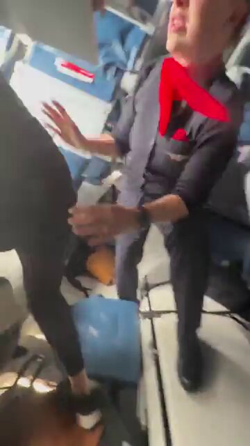 Flight attendants evacuating passengers from the upside down Delta plane that crashed in Toronto