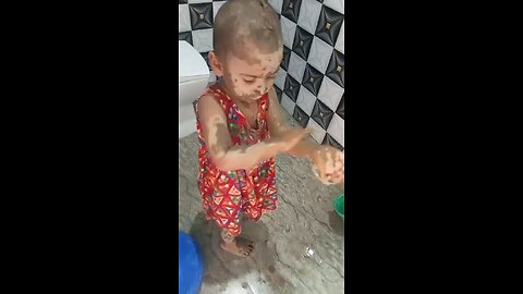 baby playing on soil