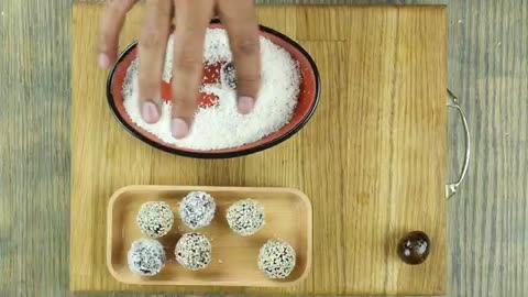 Khajoor Balls (dates) coated with coconut and sesame seeds- Food Fusion