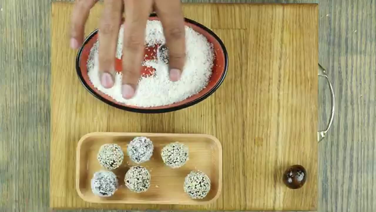Khajoor Balls (dates) coated with coconut and sesame seeds- Food Fusion