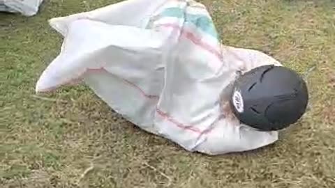 Sack race wearing helmet