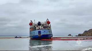 Russian emergency workers build path to reach tanker that continues to spill oil into Kerch Strait