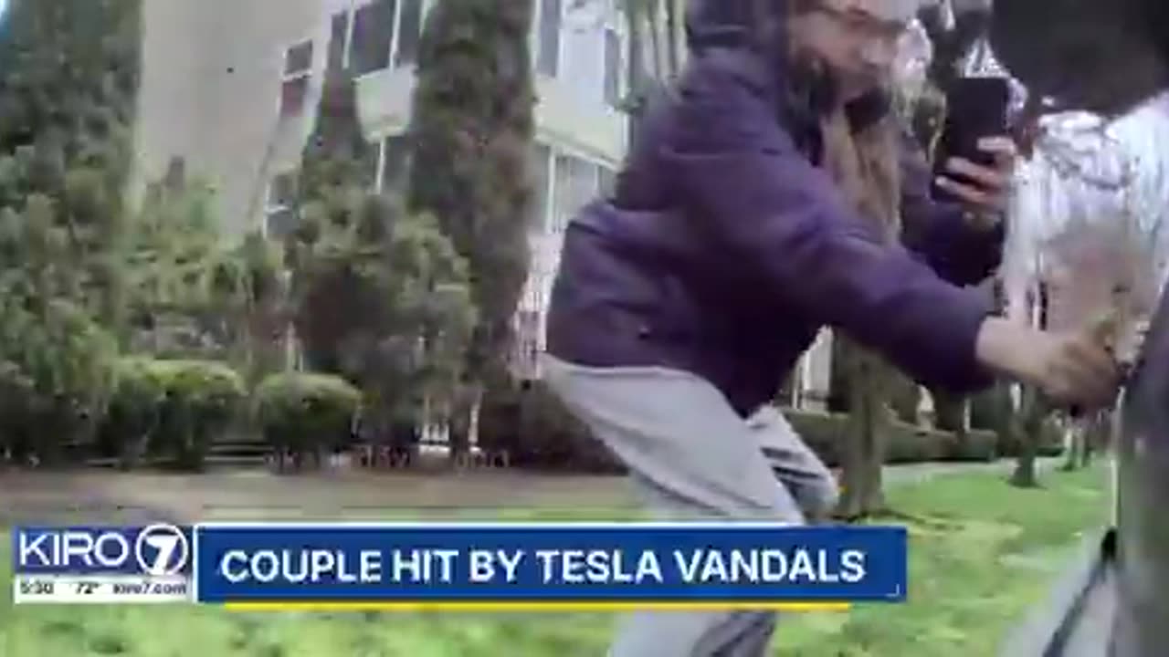 Person is being sought in Seattle after being caught on camera vandalizing a Tesla scratching it