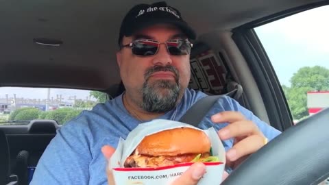 Jack eats from a Hardee's Parking Lot