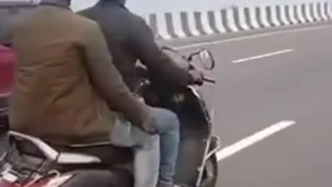 Car Shoves Moped For Kilometers