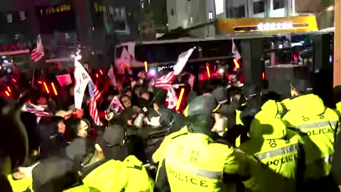 Police face off with protesting pro-Yoon supporters outside court