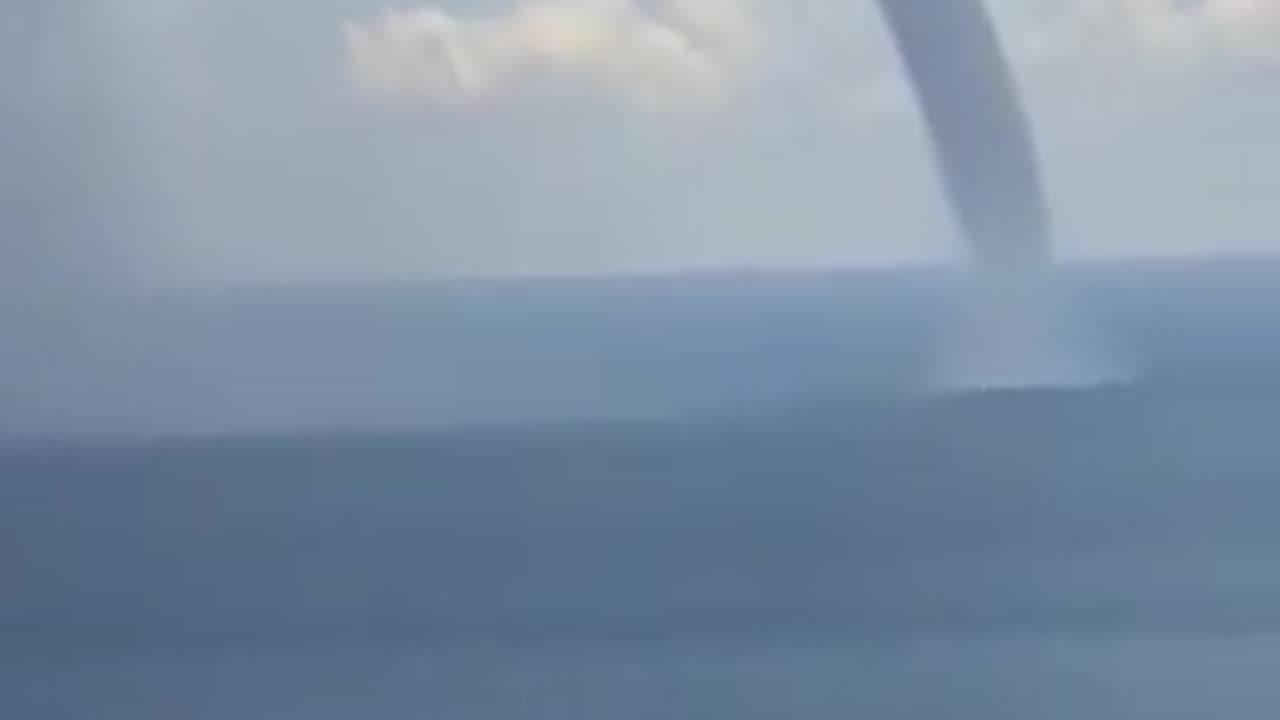 A waterspout in Punaʻauia, Tahiti, France