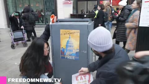 "Go Home Fascists" and "Eat The Rich" posters plastered along the Anti-Trump march