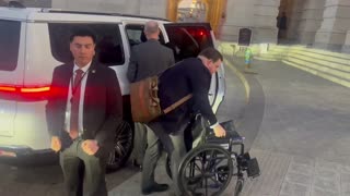 Senator Mitch McConnell arrives to votes in a boot and a wheelchair.