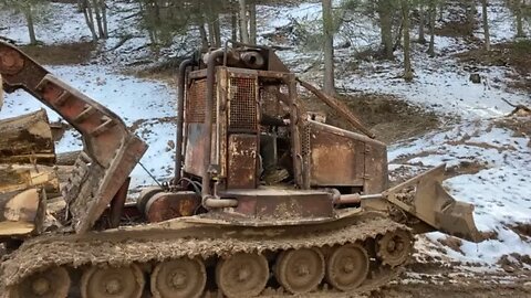 KMC logging skidder with logs