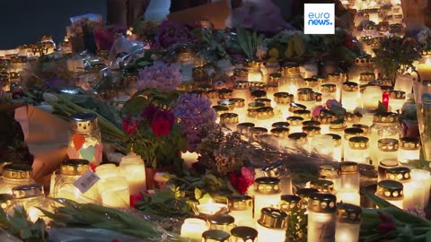 People in Örebro light candles in tribute to victims of Swedish mass shooting