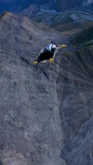 Man use carpet instead of wingsuit for base jump