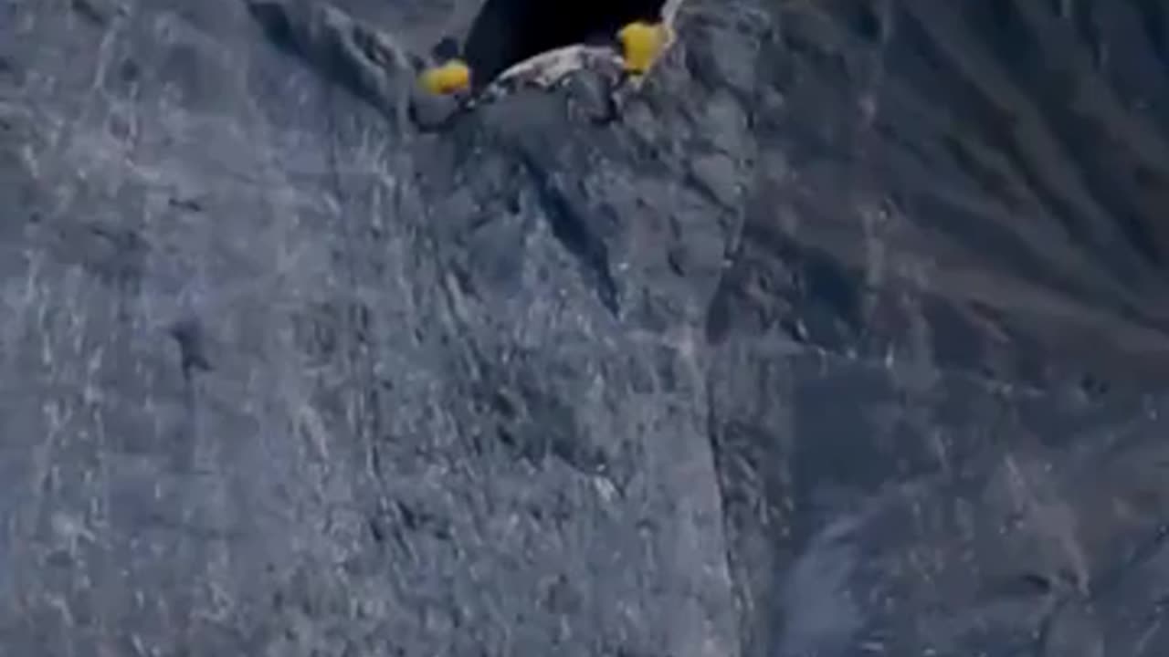 Man use carpet instead of wingsuit for base jump