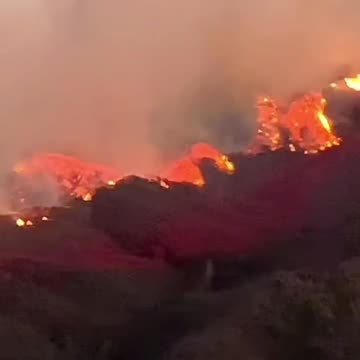 A view of wildfire reaching Encino, California