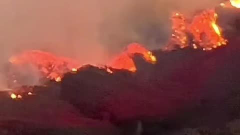 A view of wildfire reaching Encino, California