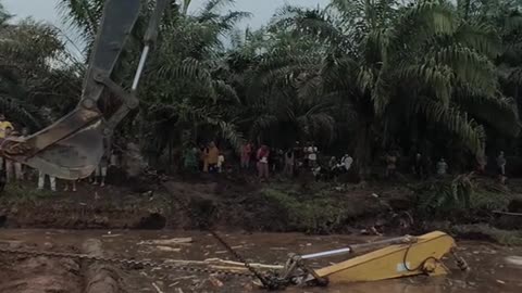 excavator installation in a muddy lake