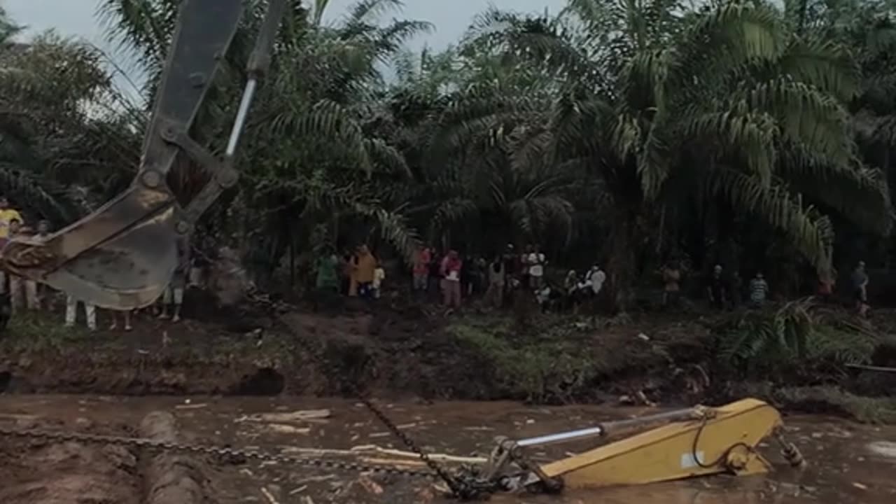 excavator installation in a muddy lake