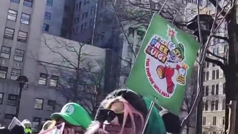 Dozens of crazy Mangione supporters are outside the NYC courthouse holding