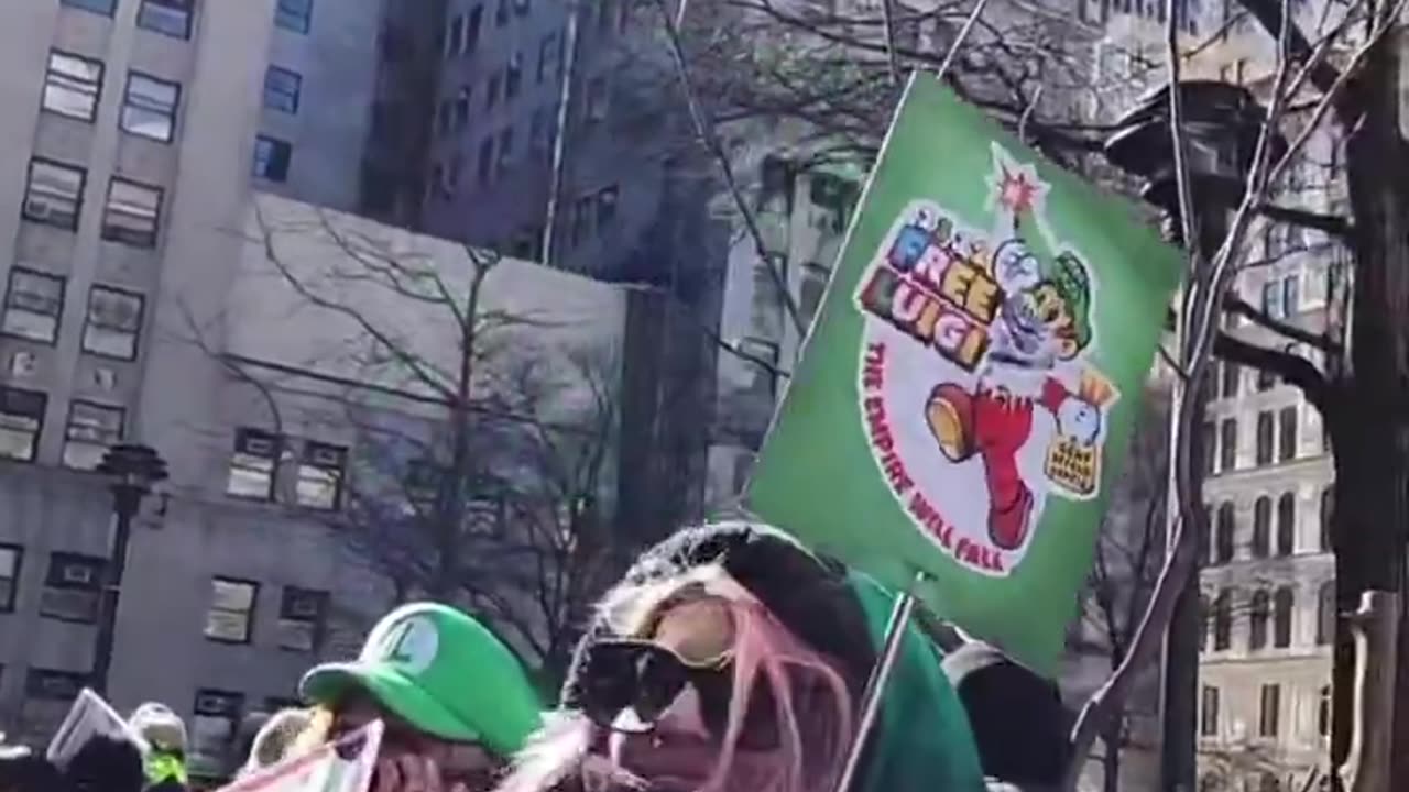 Dozens of crazy Mangione supporters are outside the NYC courthouse holding