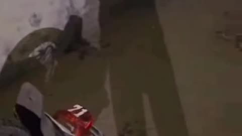 Boy falling in drainage with bike