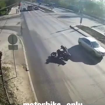 Motorcyclist catches on fire, motorcycle bursts into flames after accident.