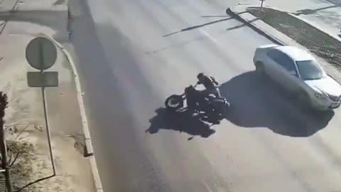 Motorcyclist catches on fire, motorcycle bursts into flames after accident.