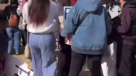 Anti-deportation protest in Oklahoma with protesters waving foreign flags.