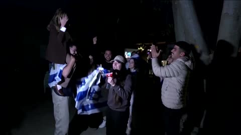 Friends of freed Israeli hostage hoist reporter during live broadcast