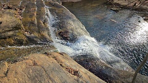 Relaxing At Top Of Falls