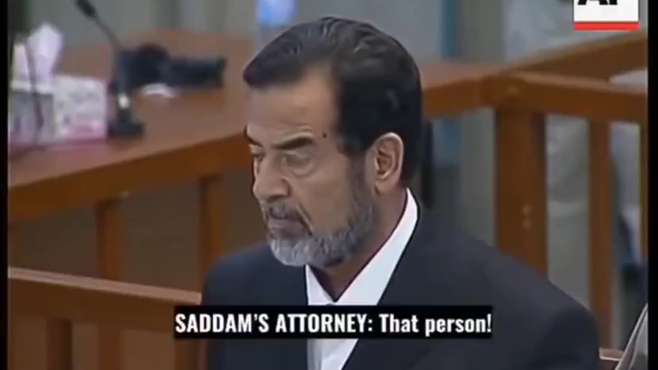 Who remembers? Saddam Hussein reacts to his own death sentence...