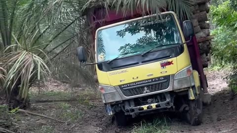 a truck loaded with paddles on an extreme road