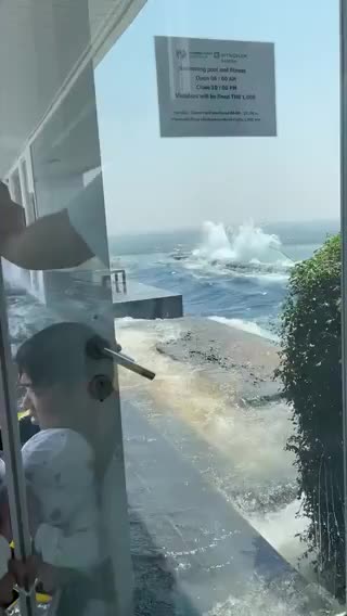 A rooftop pool on a high-rise in Thailand sways intensely after a strong earthquake in Myanmar.