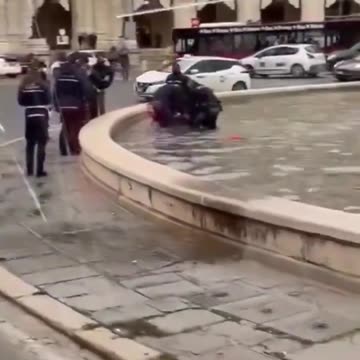African Migrant naked in fountain - Italy