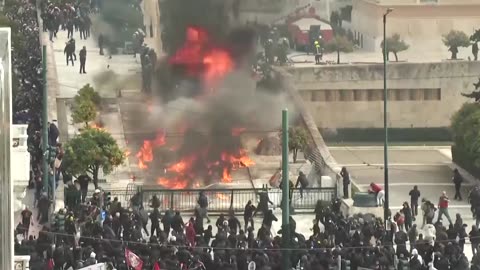 Protesters throw petrol bombs during protest in Athens