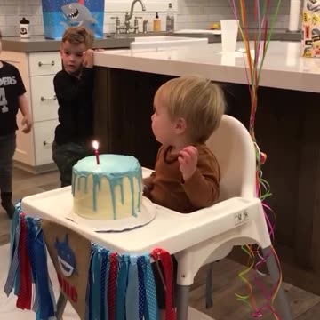 "Adorable Baby Boy's Hilarious Birthday Cake Moment!"