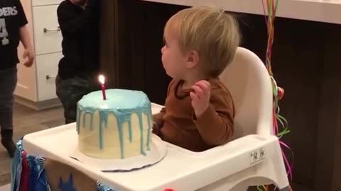 "Adorable Baby Boy's Hilarious Birthday Cake Moment!"