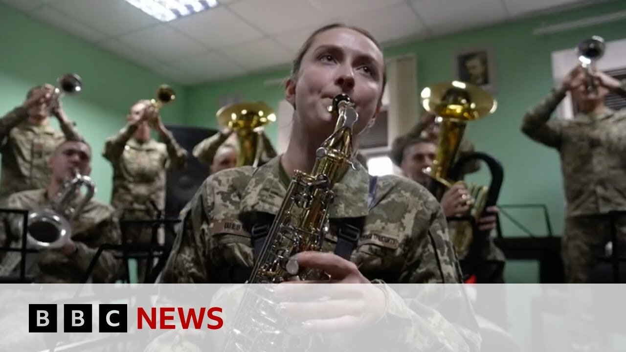 Ukrainian military band use weapons to play Christmas carols | BBC News