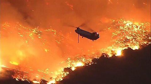 Helicopters battle flames as Palisades Fire burns on Santa Monica Mountains