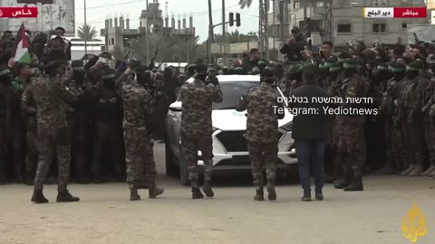 The vehicles with the hostages at the transfer point.